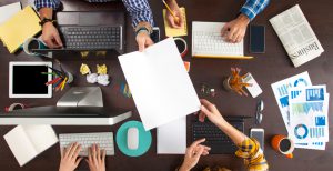 Group of Business People Working on an Office Desk